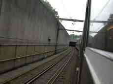 train going down a tunnel rails 