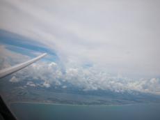 jacco curacao island sea shore airplane wing window flying sky view distance clouds