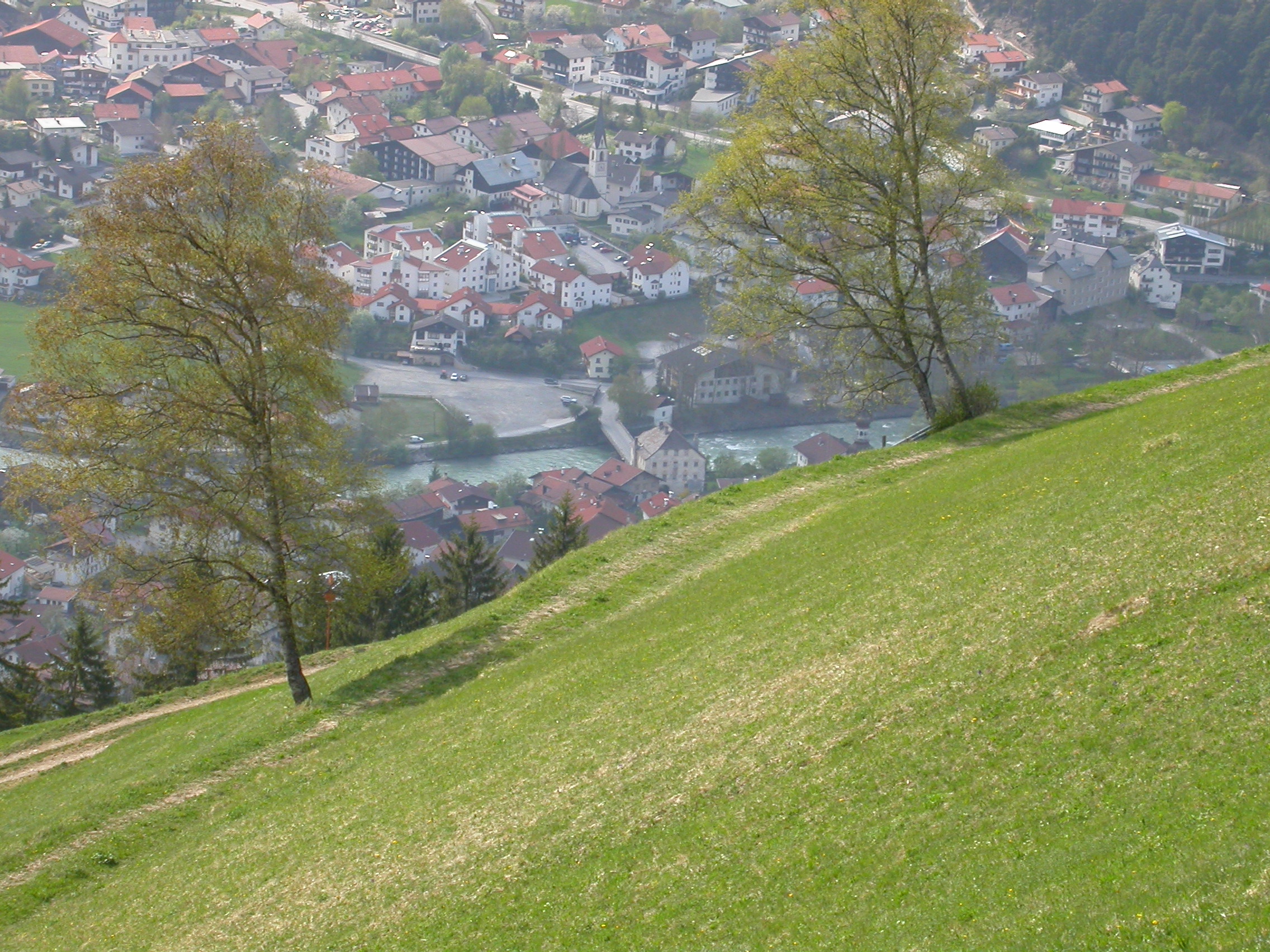 paul hill hillside view city town roofs slope sloping green grass downhill