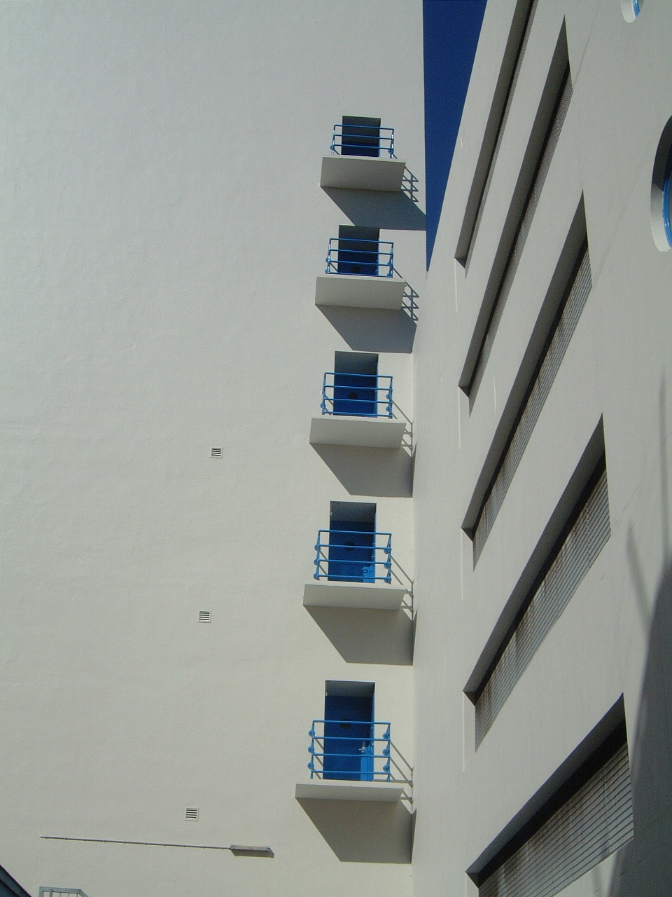 white building balconies fences facade architecture maartent