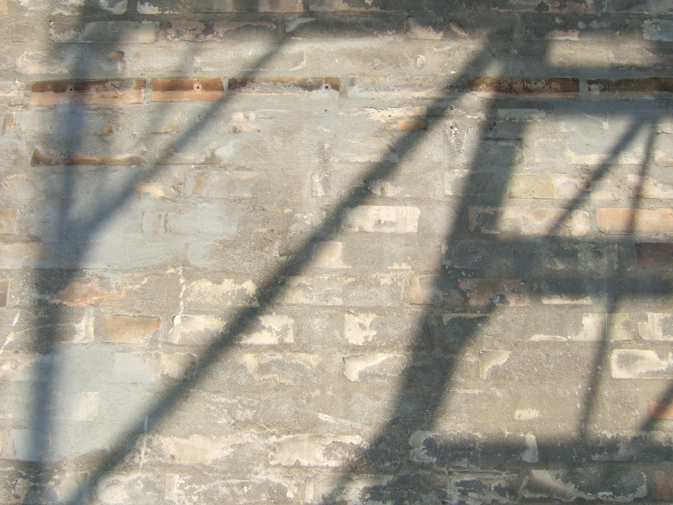 tabus wall with shadows of stairs