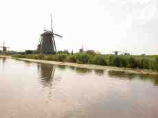 eva windmills water waterside reflection dutch the netherlands wind