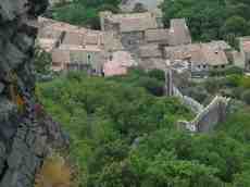 geoff_vane village roofs castle walls stone ruins hillside