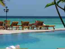 melvin architecture exteriors pool swimmingpool tan tanning woman sunbathing palmtree deckchair chair chairs deckchairs tropic tropical sea ocean