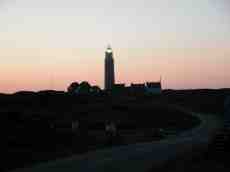 coastal outpost lighthouse lamp village small hillside