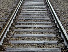 rails iron wood steel bolts gravel shine
