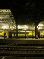 train trains station speeding past rails