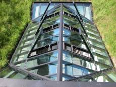 glass roof in grassy field meadow