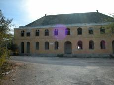 abandoned building house old arced windows arc arches 
