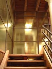 maartent architecture interiors staircase stairs glass wall metal yellow