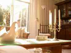 eva living room beautifully lit by sun warmth candles peace relaxation 