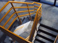 staircase stairs metal yellow concrete bunker interior