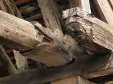 geoff_vane wooden beam beams spoke inner workings supporting support carving face decoration