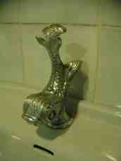 maartent fish sculpture tap bronze decorated indoor bathroom