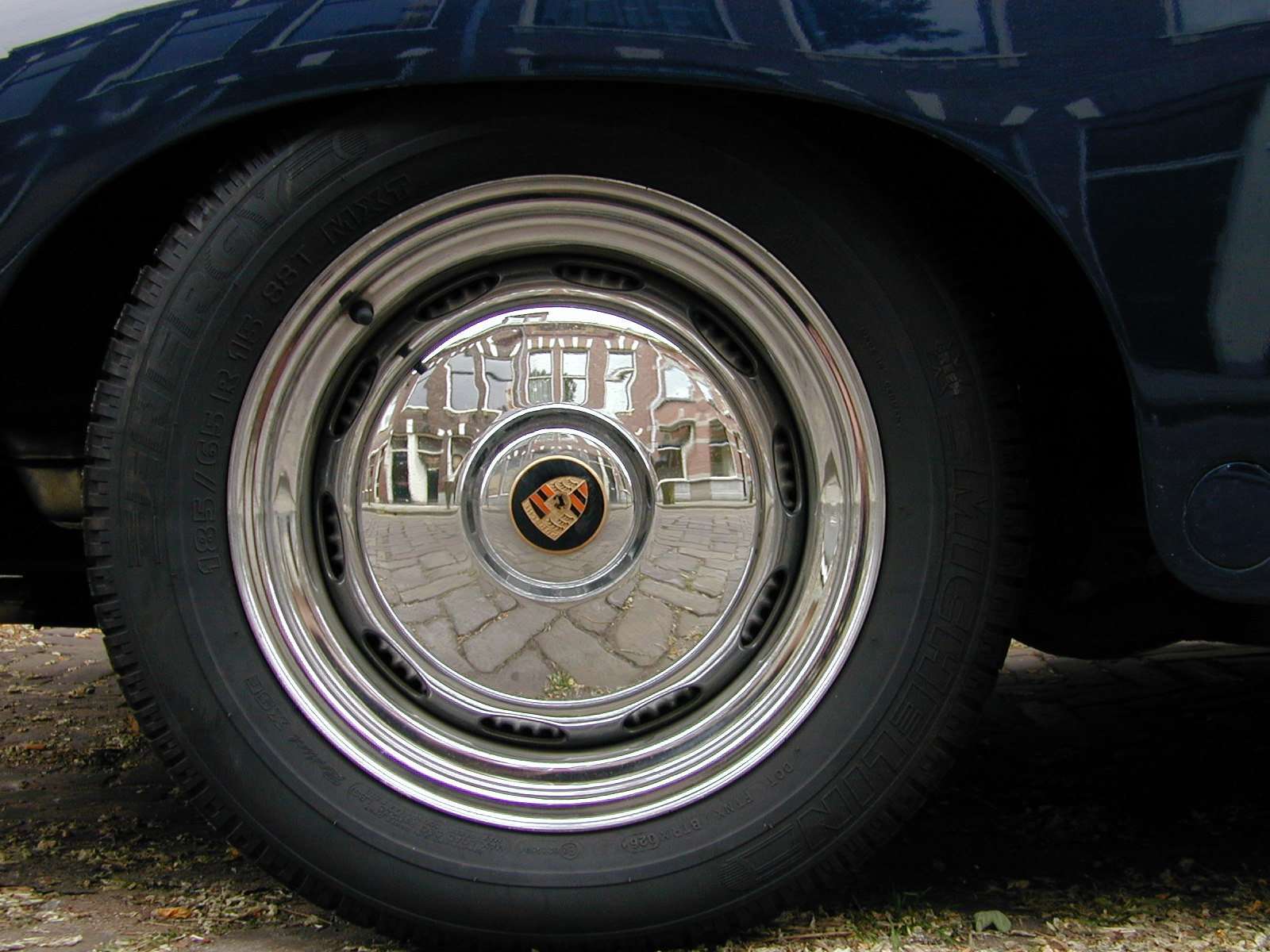 wheel tire rubber chrome porsche brand logo objects mechanics reflection circle