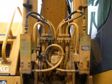 crane yellow machine handles pipes hydrolics