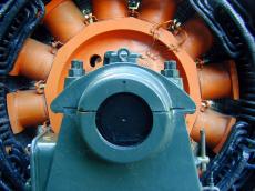 turbine electricity water power powerplant engine big machinery mechanic orange black grey gray circle