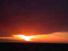 sundown red glowing romantic yellow setting clouds