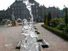 water fountain spouting shape flowing flow droplets spray mansion house garden