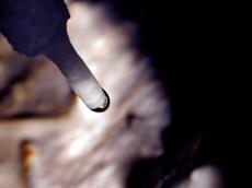 cavern grotto cave den waterdrip drip water lime dark white stalactite