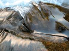 nature elements water flowing river waves rock rocks