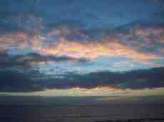 nicoleluneburg sundown romantic vista clouds warm blue sea