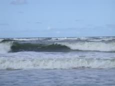 sea shore rolling wave waves spray break breaking on the nature storm at 
