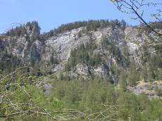 paul horstman rocky range cliff cliffs mountain rreservation slope slopes face trees growing on tof of a
