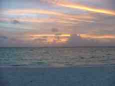 melvin sunset sunrise ocean sea shore clouds