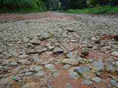 poows path rocks pebbles red eart dirt ground road 