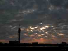 skyline buildings broadcast tower dusk outline