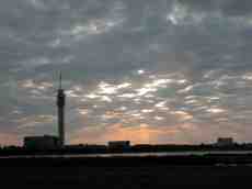 sky broadcasting tower light clouds