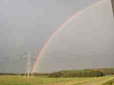 rainbow grey gray clouds nature electricity pilons
