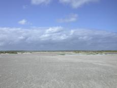 beach sand dunes blue sky clouds