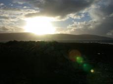 nature landscapes sunset sunrise dusk dawn hillside lake sun sea ocean lensflare silhouette