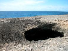 sea beach rocky rocks cave dark hole