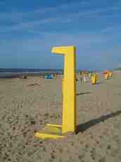 maartent pole yellow beach ocean sand