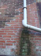 tabus drainpipe pipe wall brick red