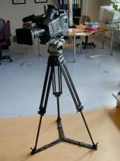 camera professional tripod lens film filming equipment standing focus philips tv