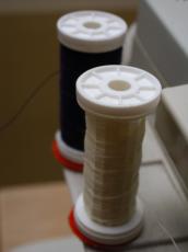 coils wire sewing threads white black