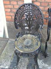 tabus old chair metal cast iron black ornate chain