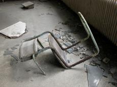 broken chair metal rust rusted rubble grey