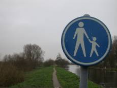 sign round blue path walking footpath pedestrian traffic road