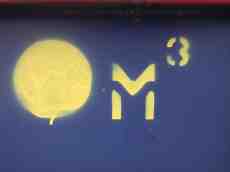 spray paint painted letter M3 yellow dot
