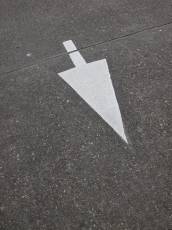 arrow on tarmac blacktop white