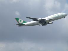 jumbo jumbojet jet 747 boeing eva-air eva air aeroplane liftoff lift-off cloud clouds sky flying landinggear landing-gear