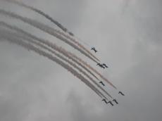 vehicles air airshow smoke aeroplane aeroplanes looping formation arrows