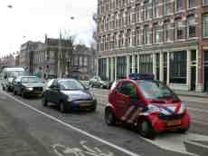 car cars red stripes waiting in line traffic lights brandweer smart kia