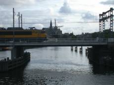train bridge speed wind mill church Netherlands Holland