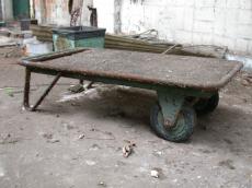 wheelbarrow transporting metal rusted trolly trolley dust layer of